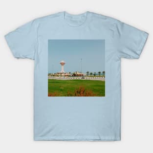 Lighthouse near blue ocean and green park with palm T-Shirt